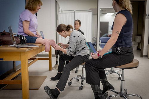 Century College students work with Barb Hinrichs as part of their studies in the O&P programs at Century College.